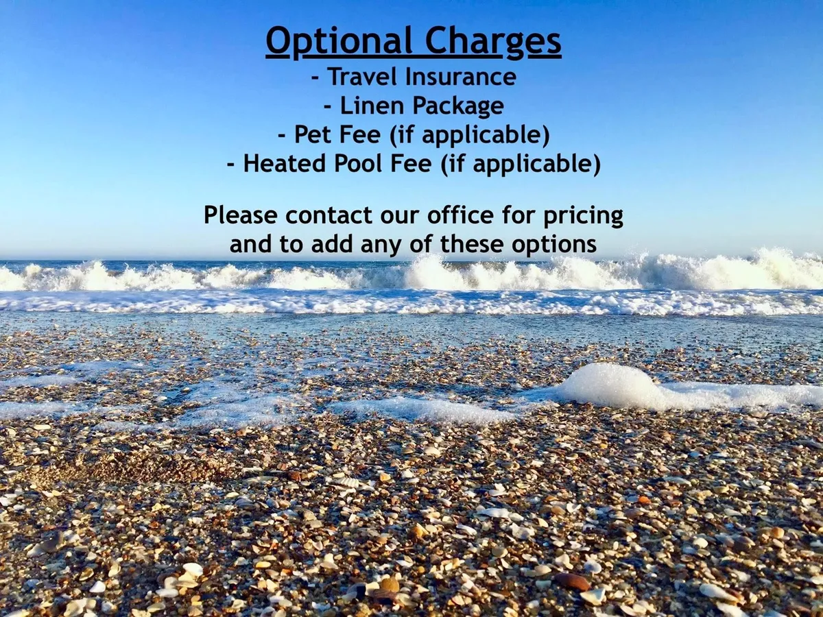 A tranquil, panoramic view of the Atlantic shoreline with gentle waves washing over the sandy beach. The photo features seashells on the shore and captures the serene, vacation-like atmosphere ideal for building sandcastles, sunbathing, and swimming.